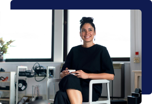 A happy, confident business owner in a professionally cleaned, tidy office space
