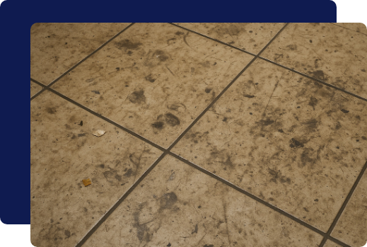 Dirty and stained commercial tile flooring.