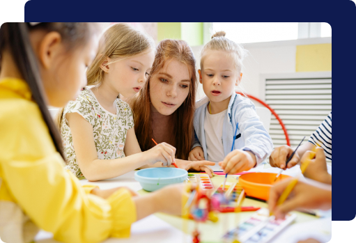 Young children and an educator in a school classroom maintained with non-toxic, eco-friendly cleaning practices